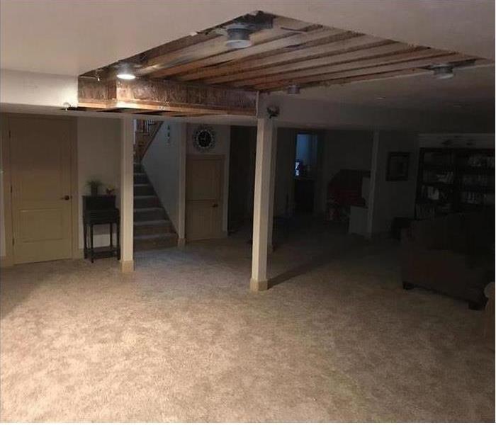 Basement with hole in the ceiling 